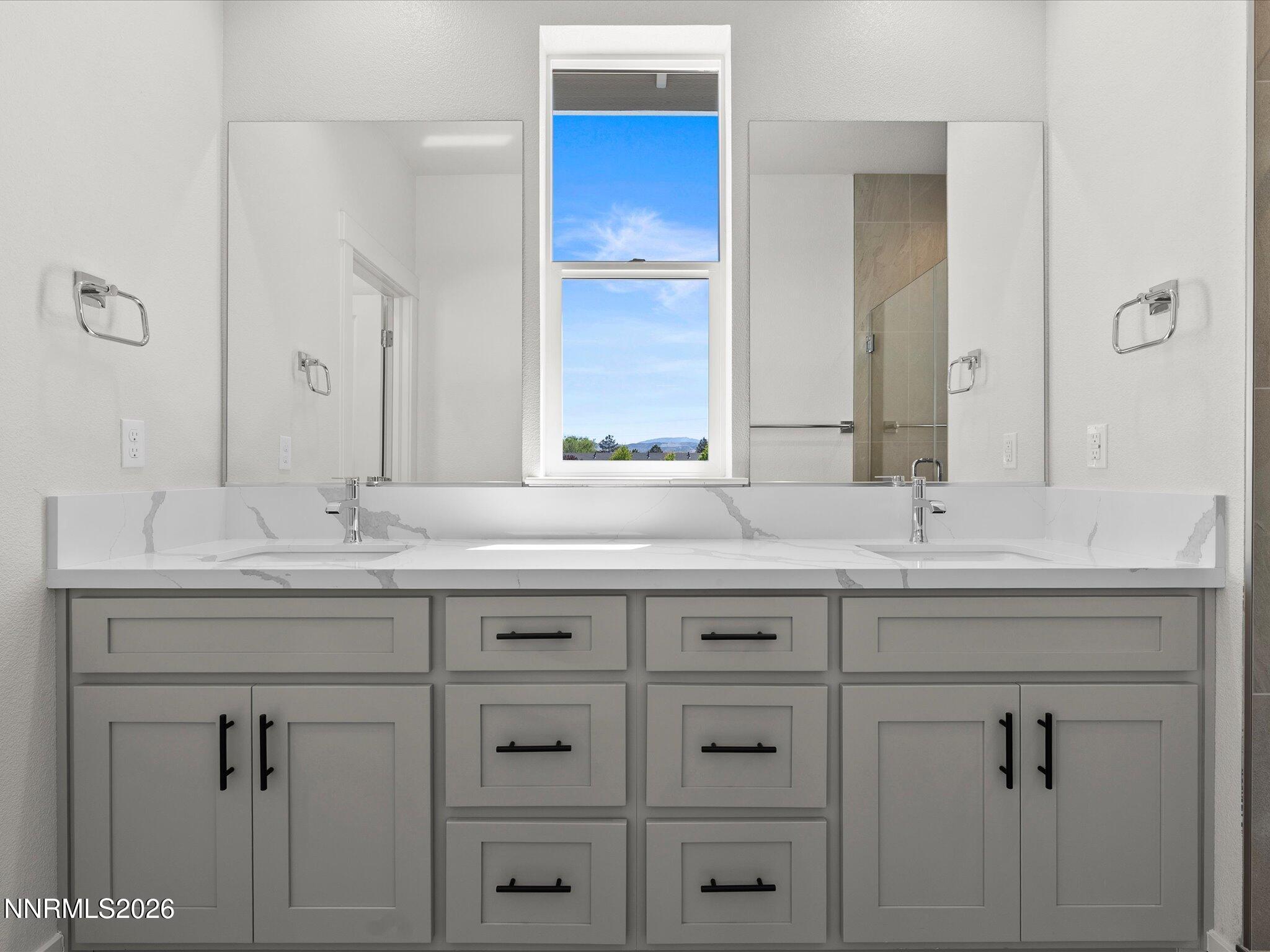 1383 Vine Gate Road, Unit HOMESITE 51 Carson City, NV 89701 - Photo 17 of 20 a bathroom with double sink and a mirror