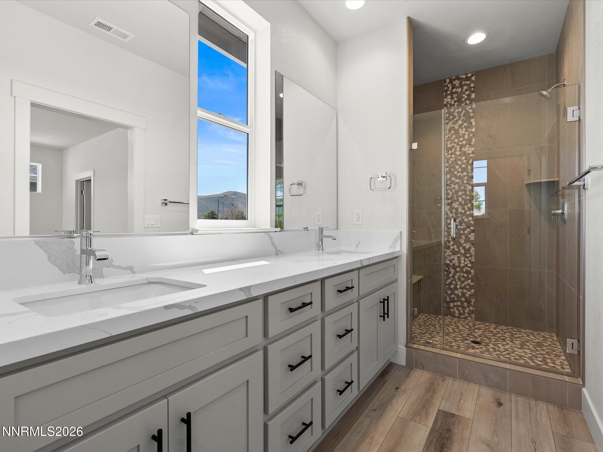 1383 Vine Gate Road, Unit HOMESITE 51 Carson City, NV 89701 - Photo 18 of 20 a bathroom with double sink and a mirror