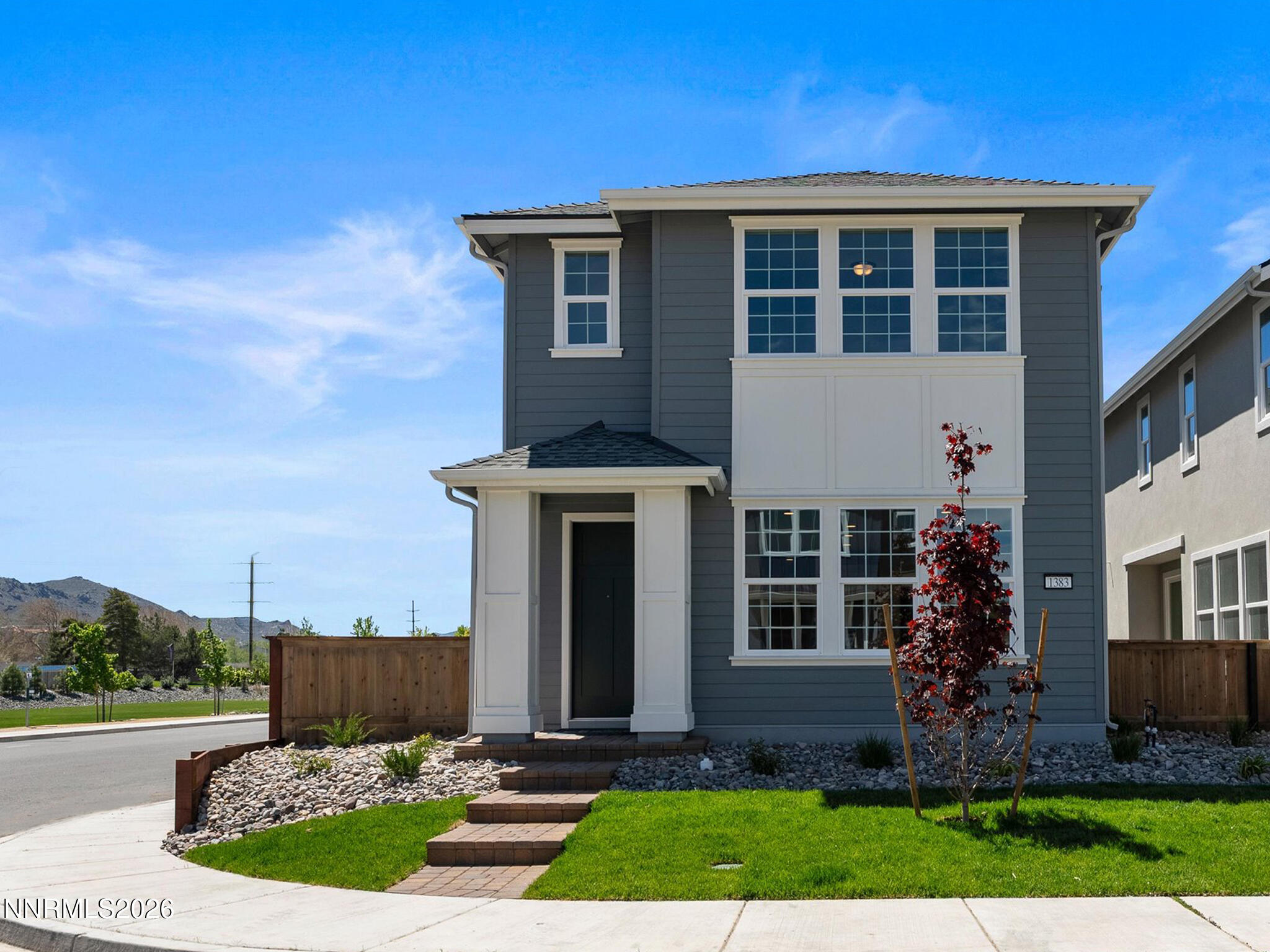 1383 Vine Gate Road, Unit HOMESITE 51 Carson City, NV 89701 - Photo 2 of 20 a front view of a house with garden