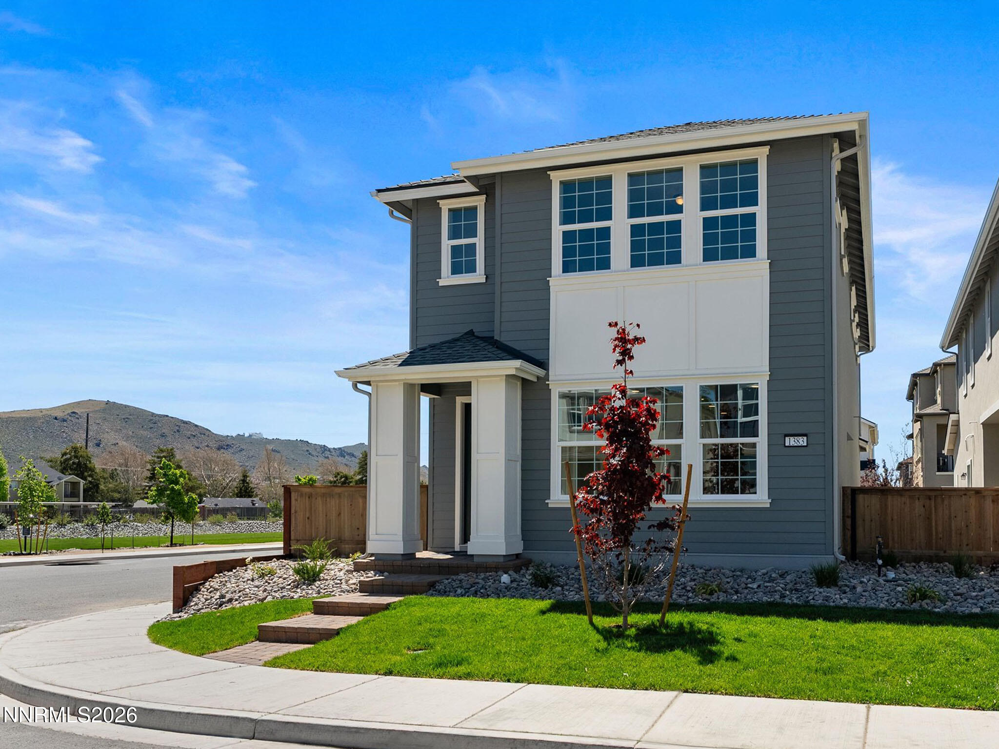 1383 Vine Gate Road, Unit HOMESITE 51 Carson City, NV 89701 - Photo 3 of 20 a front view of a house with garden