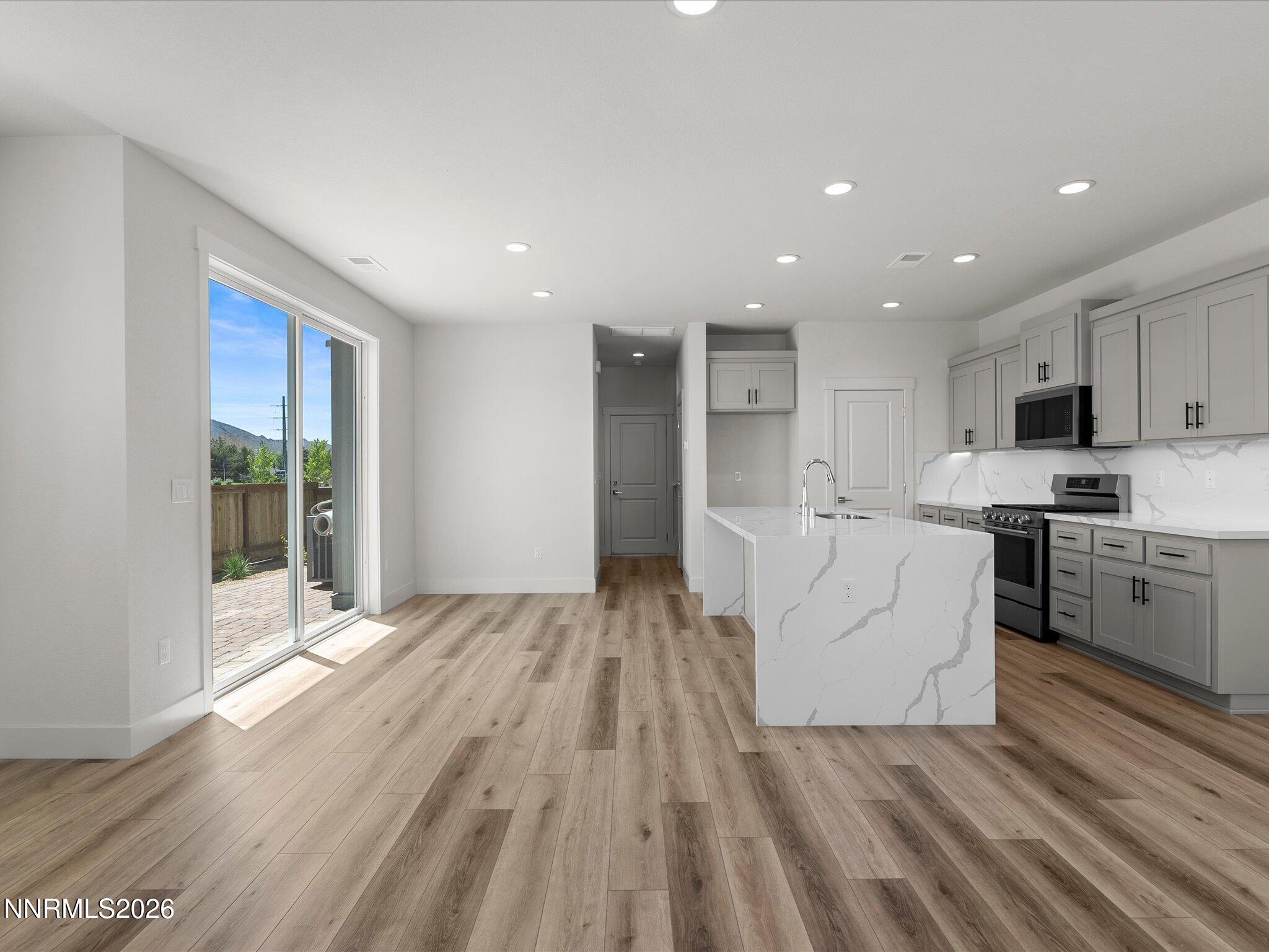 1383 Vine Gate Road, Unit HOMESITE 51 Carson City, NV 89701 - Photo 5 of 20 a view of kitchen with cabinets and wooden floor