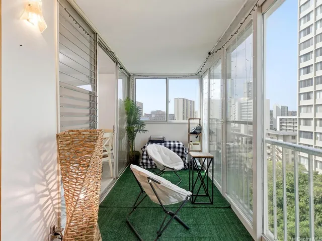 a view of a balcony with chair and table