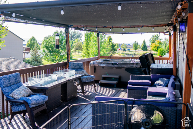 2269 Clear Creek Road Nibley, UT 84321 - Photo 10 of 27 Wooden terrace with a hot tub and outdoor dining space