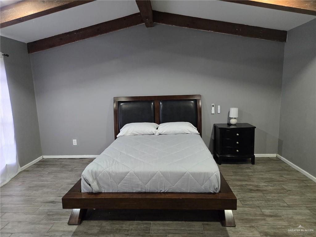 800 East Tulipan Avenue Hidalgo, TX 78557 - Photo 12 of 12 a bedroom with a bed and wooden floor