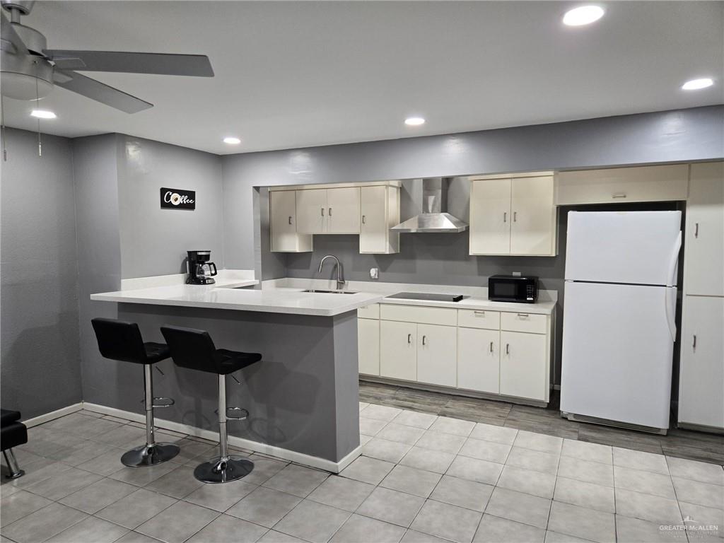 800 East Tulipan Avenue Hidalgo, TX 78557 - Photo 2 of 12 a kitchen with a sink appliances and cabinets