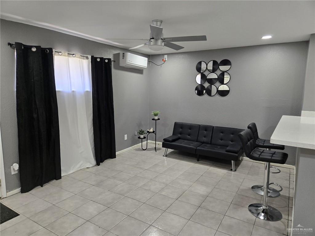 800 East Tulipan Avenue Hidalgo, TX 78557 - Photo 3 of 12 a living room with furniture and a chandelier