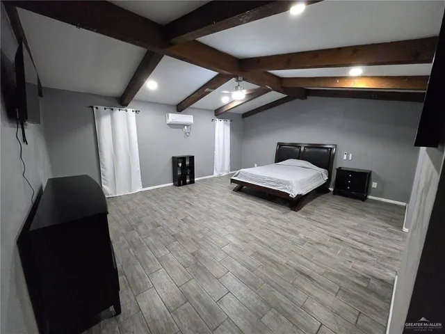 a room with a bed and a mirror