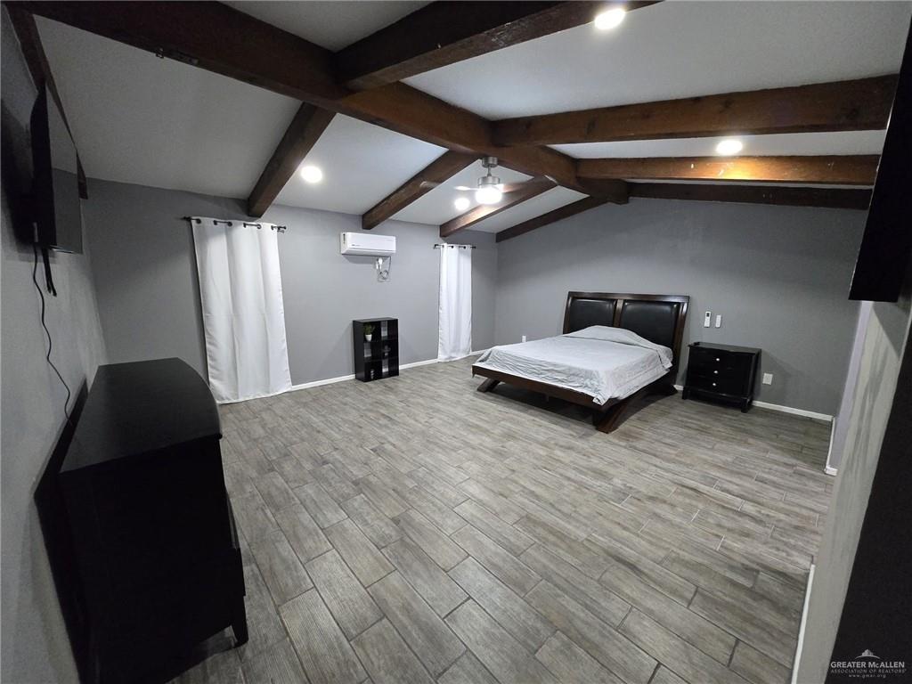 800 East Tulipan Avenue Hidalgo, TX 78557 - Photo 5 of 12 a room with a bed and a mirror