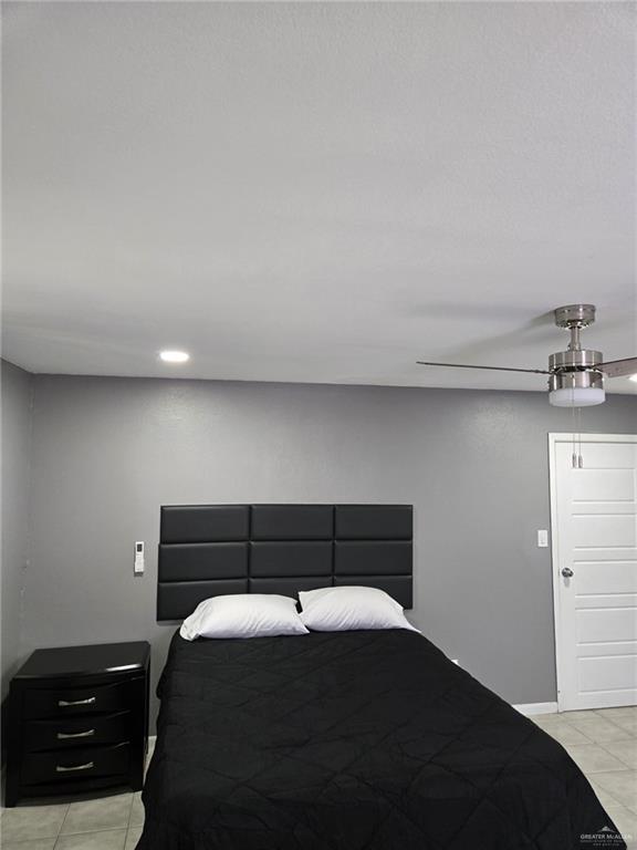 800 East Tulipan Avenue Hidalgo, TX 78557 - Photo 8 of 12 a bedroom with a bed and a night stand