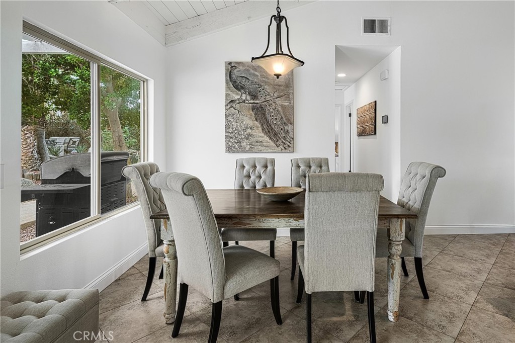 73425 Haystack Road Palm Desert, CA 92260 - Photo 12 of 30 a view of a dining room with furniture window and outside view