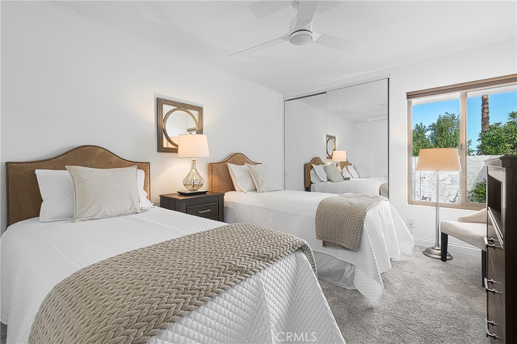 73425 Haystack Road Palm Desert, CA 92260 - Photo 28 of 30 a bedroom with two beds and large window