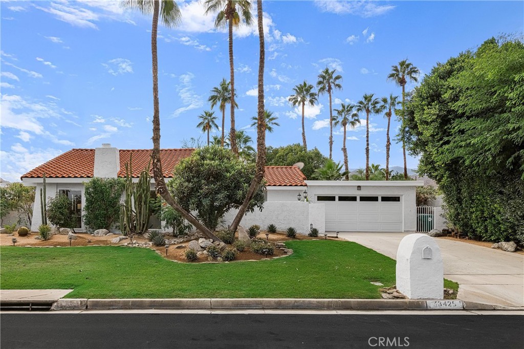 73425 Haystack Road Palm Desert, CA 92260 - Photo 3 of 30 a front view of a house with garden