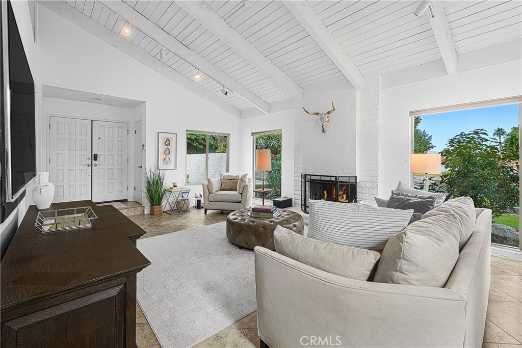 73425 Haystack Road Palm Desert, CA 92260 - Photo 7 of 30 a living room with furniture and a fireplace