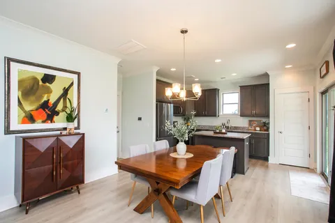 a kitchen with a table and chairs in it