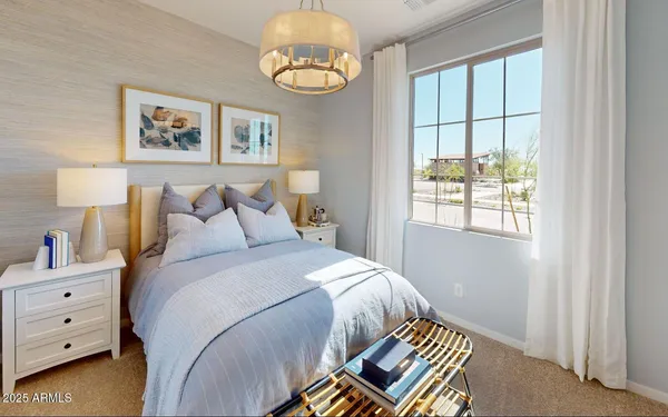 a hallway with wooden floor and chandelier