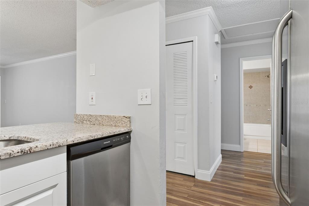 10307 Councils Way Temple Terrace, FL 33617 - Photo 12 of 50 a view of a kitchen counter space and wooden floor