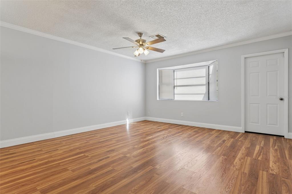10307 Councils Way Temple Terrace, FL 33617 - Photo 20 of 50 wooden floor in an empty room with a window