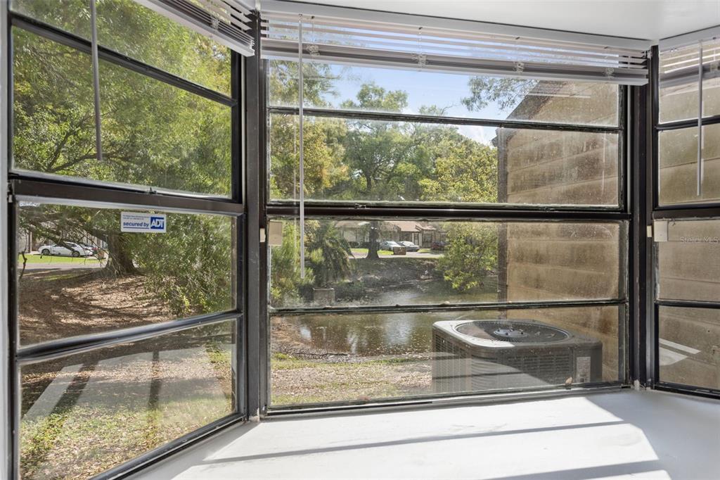 10307 Councils Way Temple Terrace, FL 33617 - Photo 21 of 50 a view of a glass door with a glass door and a window