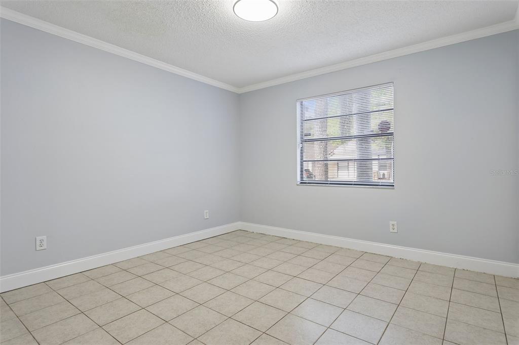 10307 Councils Way Temple Terrace, FL 33617 - Photo 24 of 50 a view of an empty room with a window