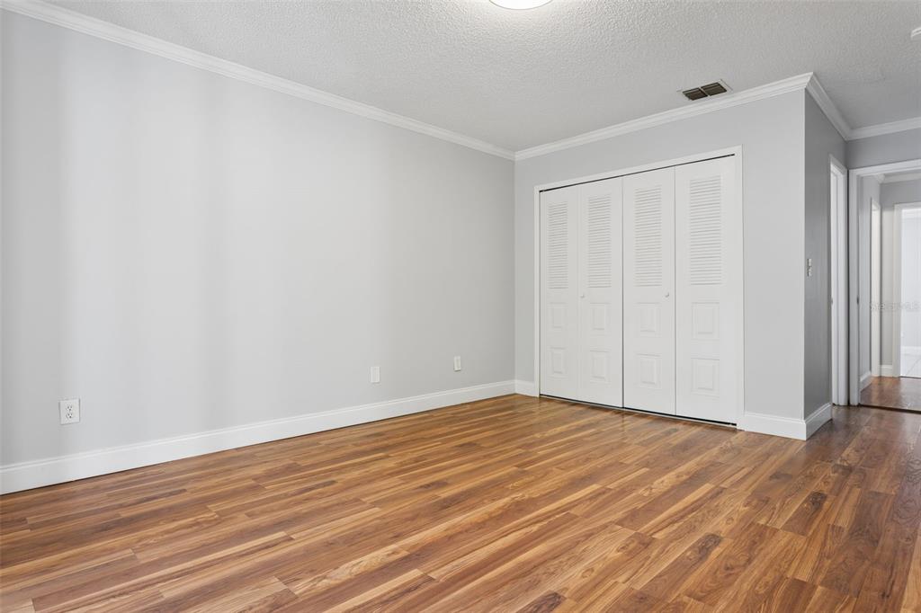 10307 Councils Way Temple Terrace, FL 33617 - Photo 34 of 50 a view of an empty room with wooden floor