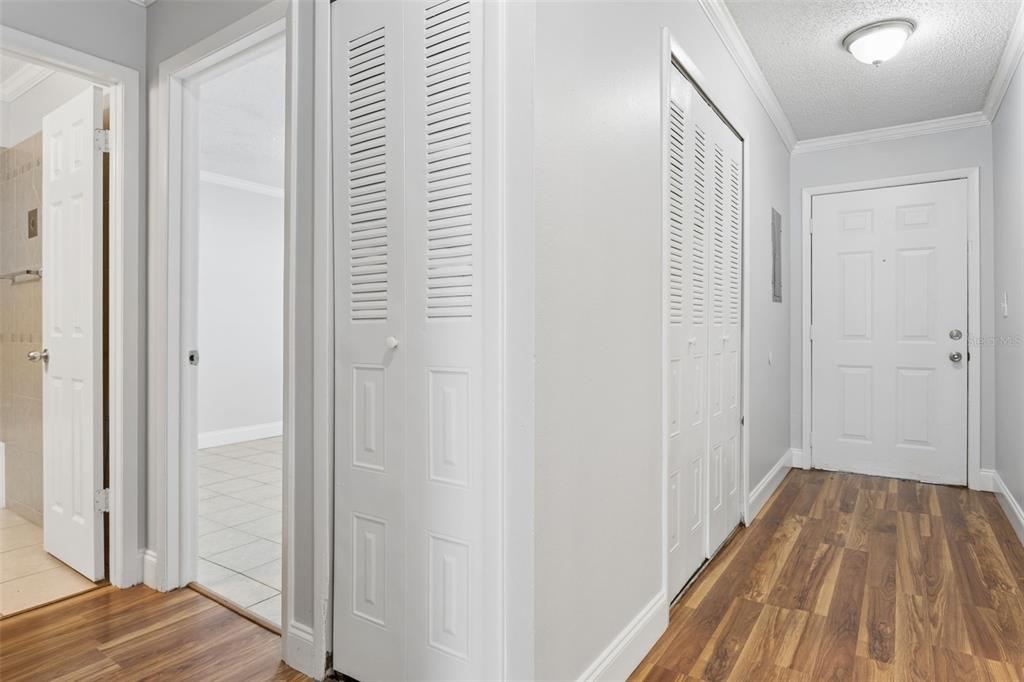 10307 Councils Way Temple Terrace, FL 33617 - Photo 5 of 50 a view of a hallway with wooden floor and closet