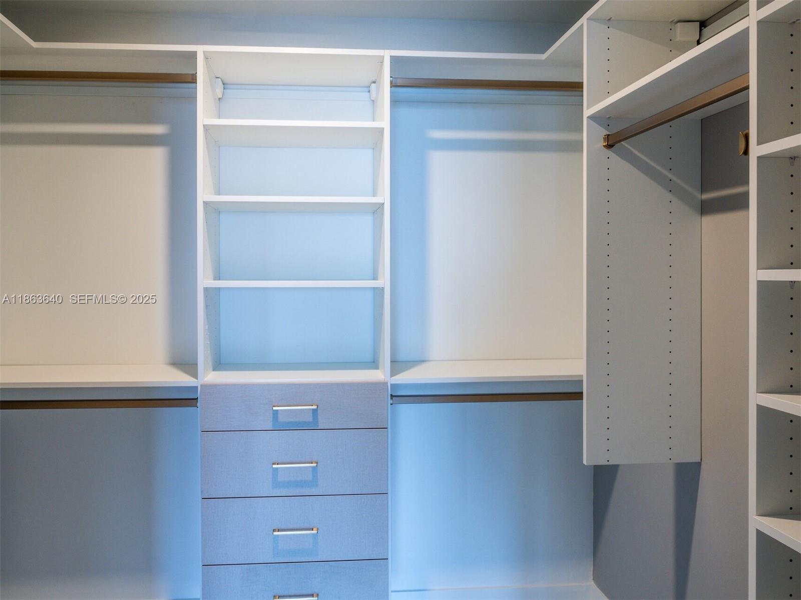 700 Northeast 24th Street, Unit 4806 Miami, FL 33137 - Photo 12 of 66 a view of an empty walk in closet