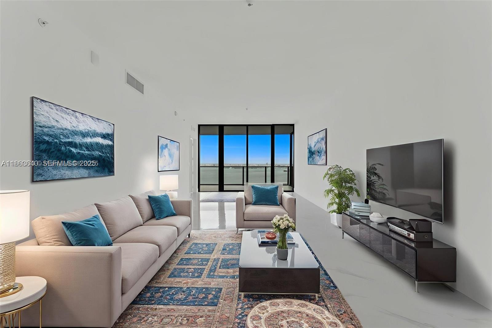 700 Northeast 24th Street, Unit 4806 Miami, FL 33137 - Photo 66 of 66 a living room with furniture a rug and a flat screen tv