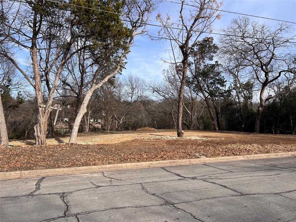2912 Maple Hill Circle Waco, TX 76708 - Photo 2 of 7 a view of a yard with large trees