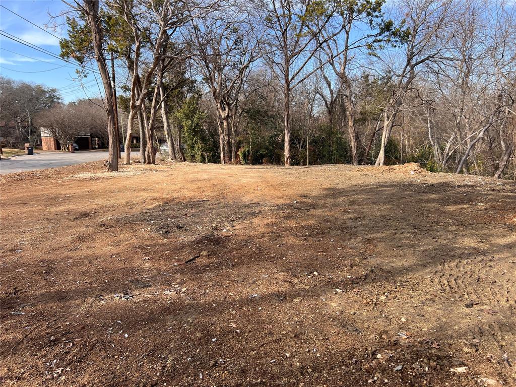 2912 Maple Hill Circle Waco, TX 76708 - Photo 4 of 7 a view of road with covered with trees