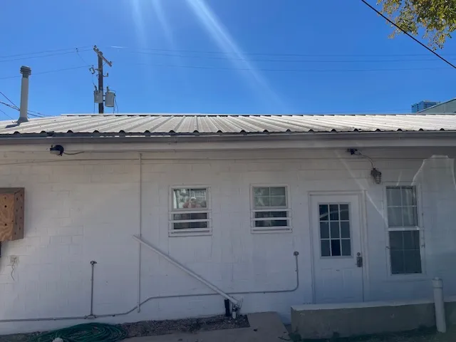 a view of a kitchen with granite countertop a sink and dishwasher