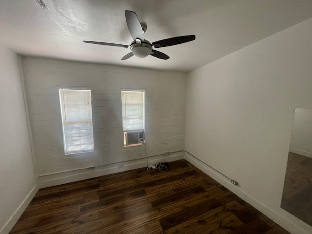 1105 East 6th Street Austin, TX 78702 - Photo 5 of 9 a view of an empty room with wooden floor and a window