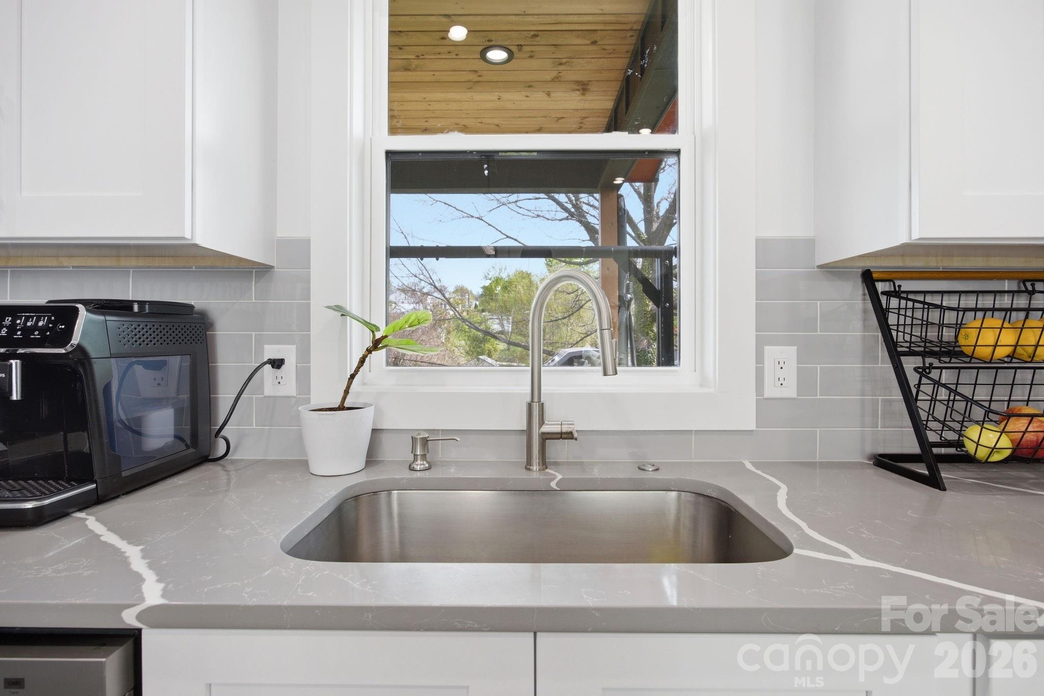 30 1st Street Canton, NC 28716 - Photo 12 of 39 a kitchen with a sink and a window