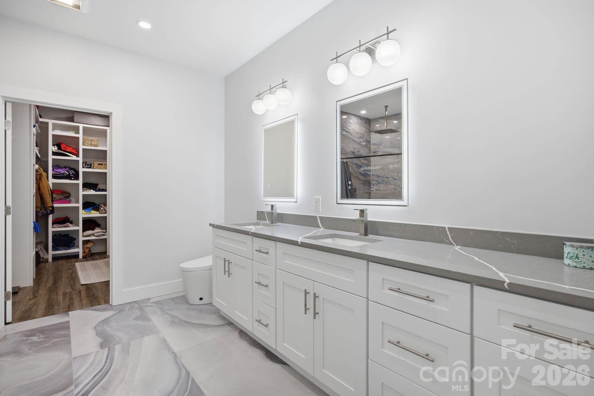 30 1st Street Canton, NC 28716 - Photo 17 of 39 a spacious bathroom with a granite countertop sink and a window