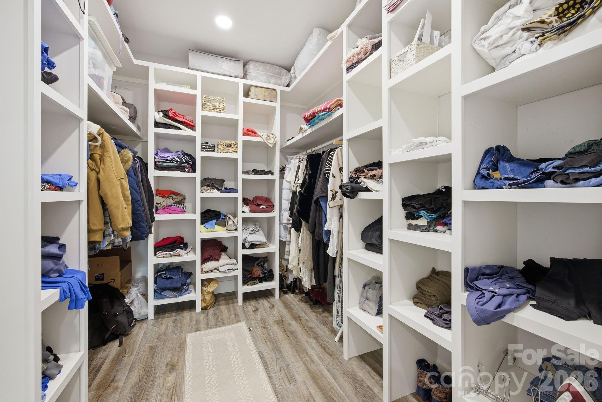 30 1st Street Canton, NC 28716 - Photo 19 of 39 a view of walk in closet with clothes and shoes