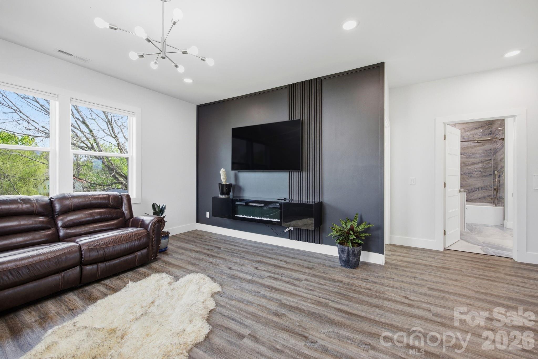 30 1st Street Canton, NC 28716 - Photo 20 of 39 a living room with furniture and a flat screen tv