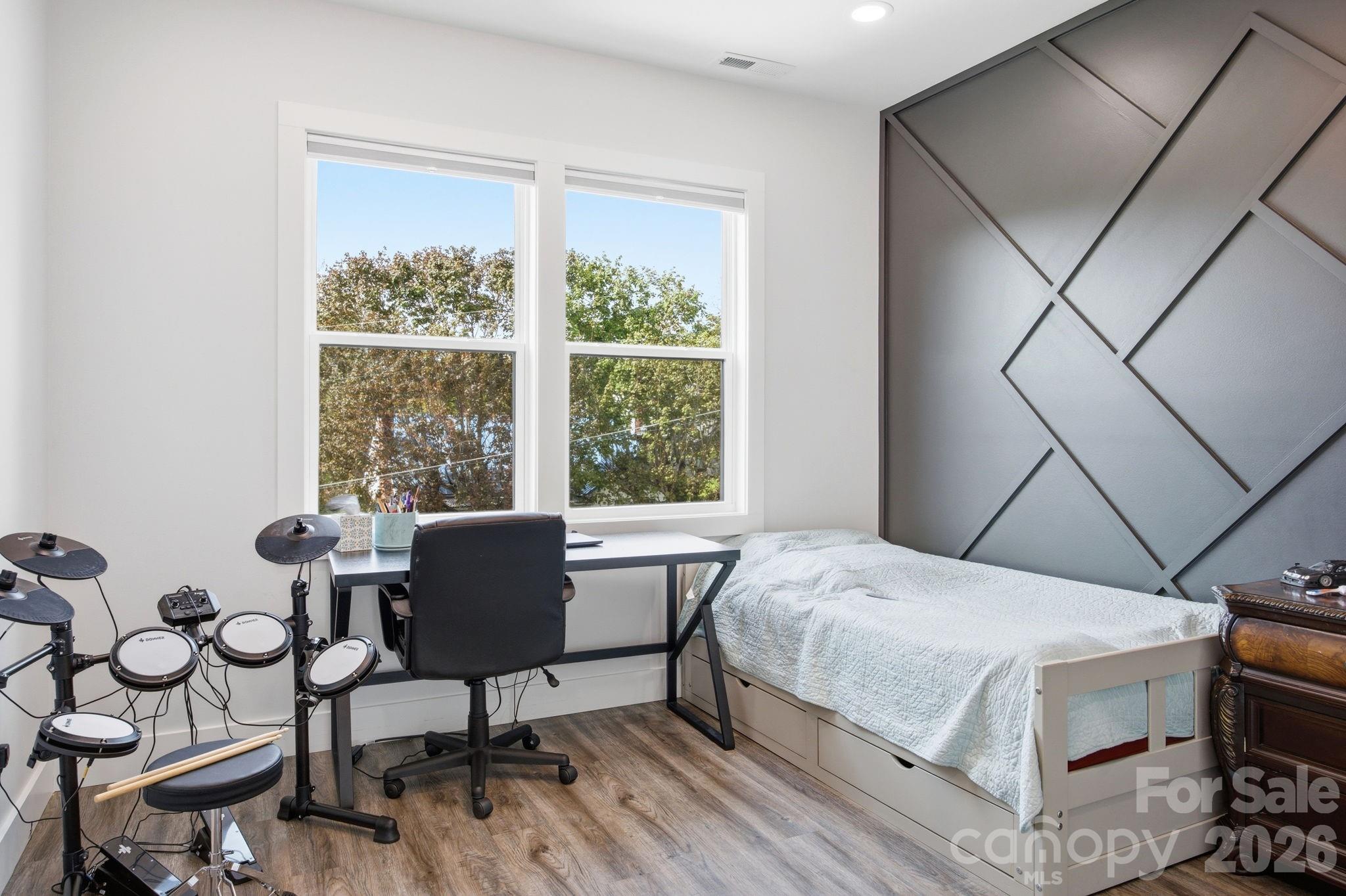 30 1st Street Canton, NC 28716 - Photo 28 of 39 a bedroom with a bed and a window