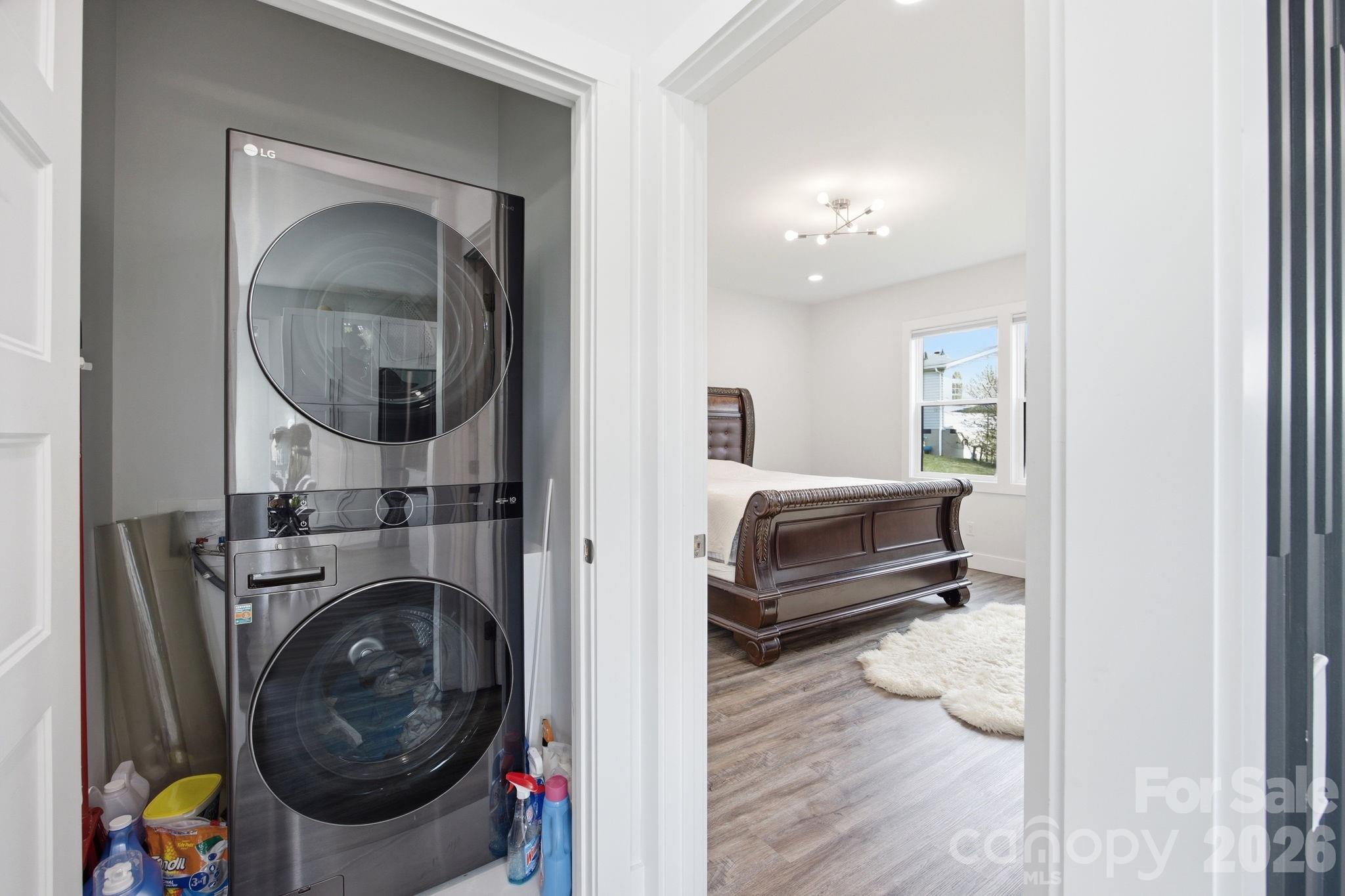 30 1st Street Canton, NC 28716 - Photo 31 of 39 a en suite bathroom with a sink and mirror