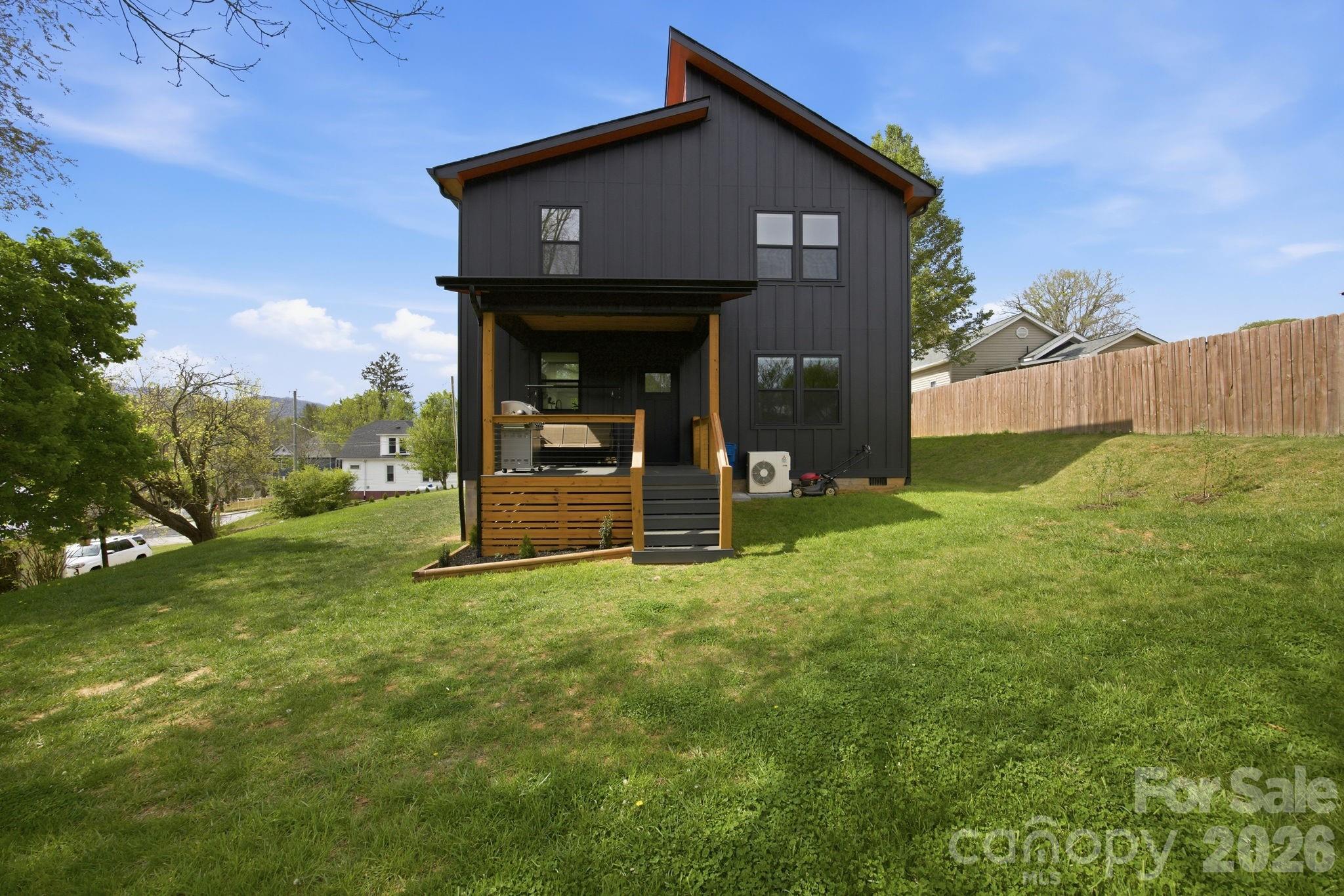 30 1st Street Canton, NC 28716 - Photo 33 of 39 a view of a tiny house with yard and a large tree