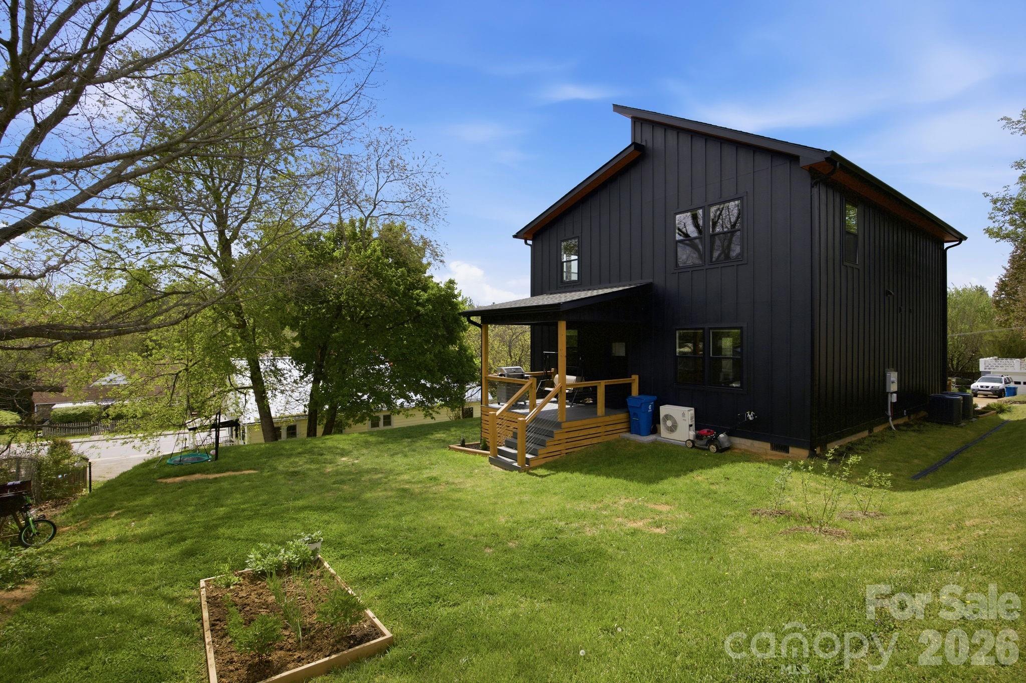 30 1st Street Canton, NC 28716 - Photo 34 of 39 a view of a house with backyard and sitting area