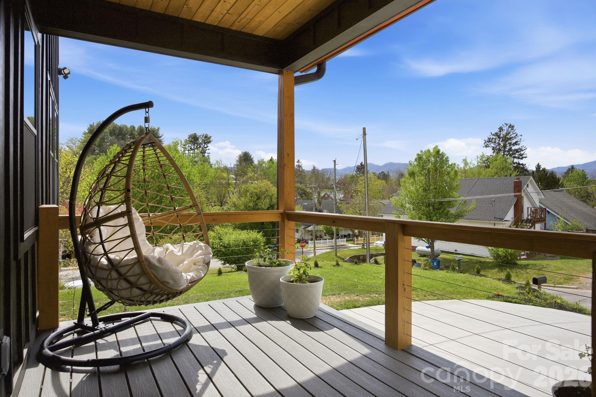 30 1st Street Canton, NC 28716 - Photo 4 of 39 a view of a balcony with chairs