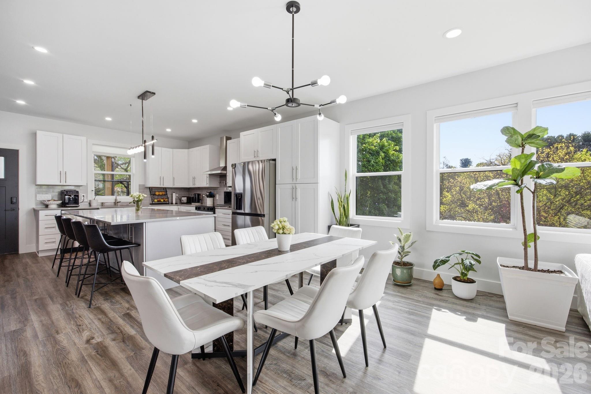 30 1st Street Canton, NC 28716 - Photo 8 of 39 a view of a dining room with furniture window and wooden floor