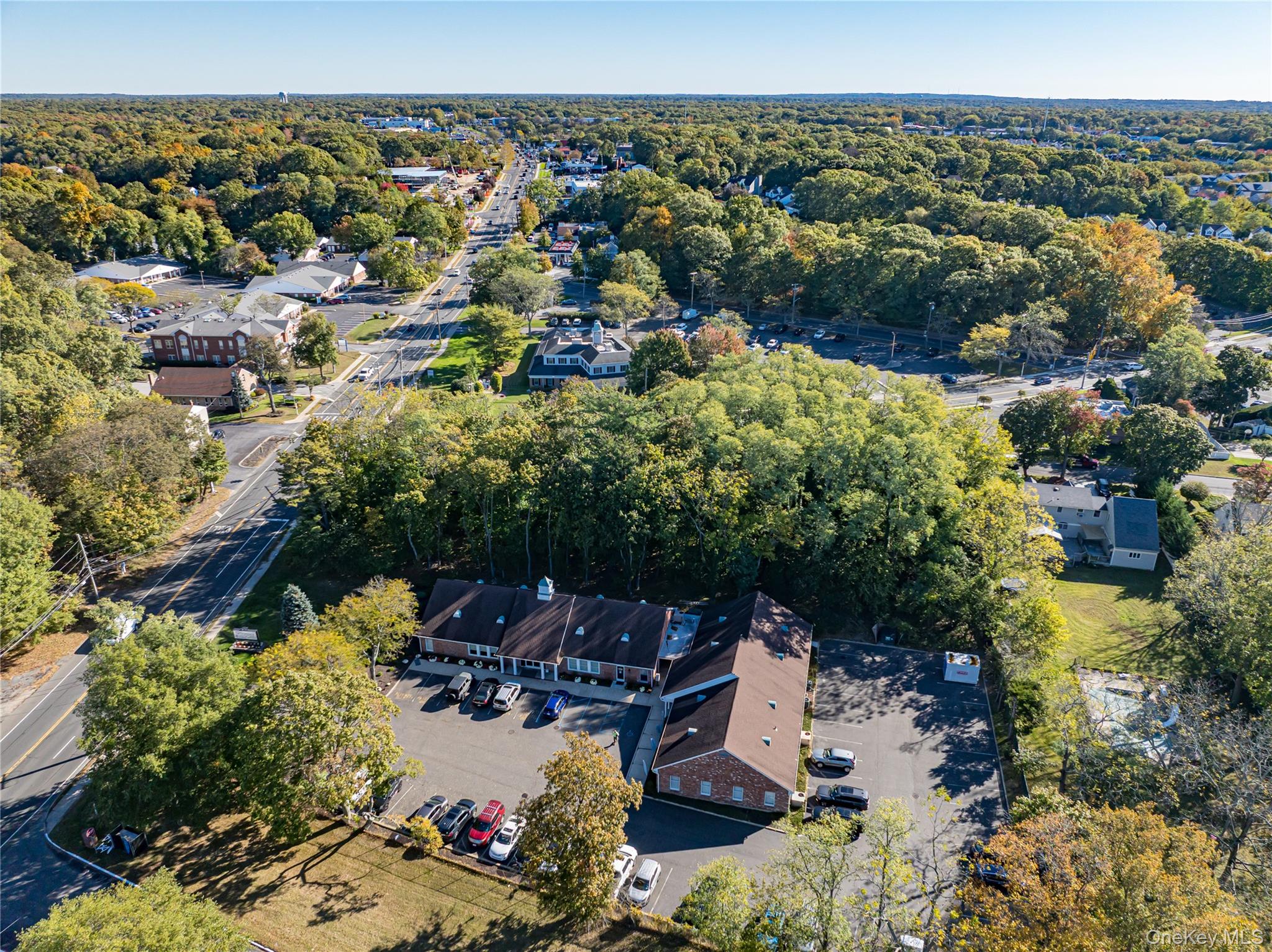 Middle Country Road Smithtown, NY 11780 - Photo 14 of 23 an aerial view of a house with a yard