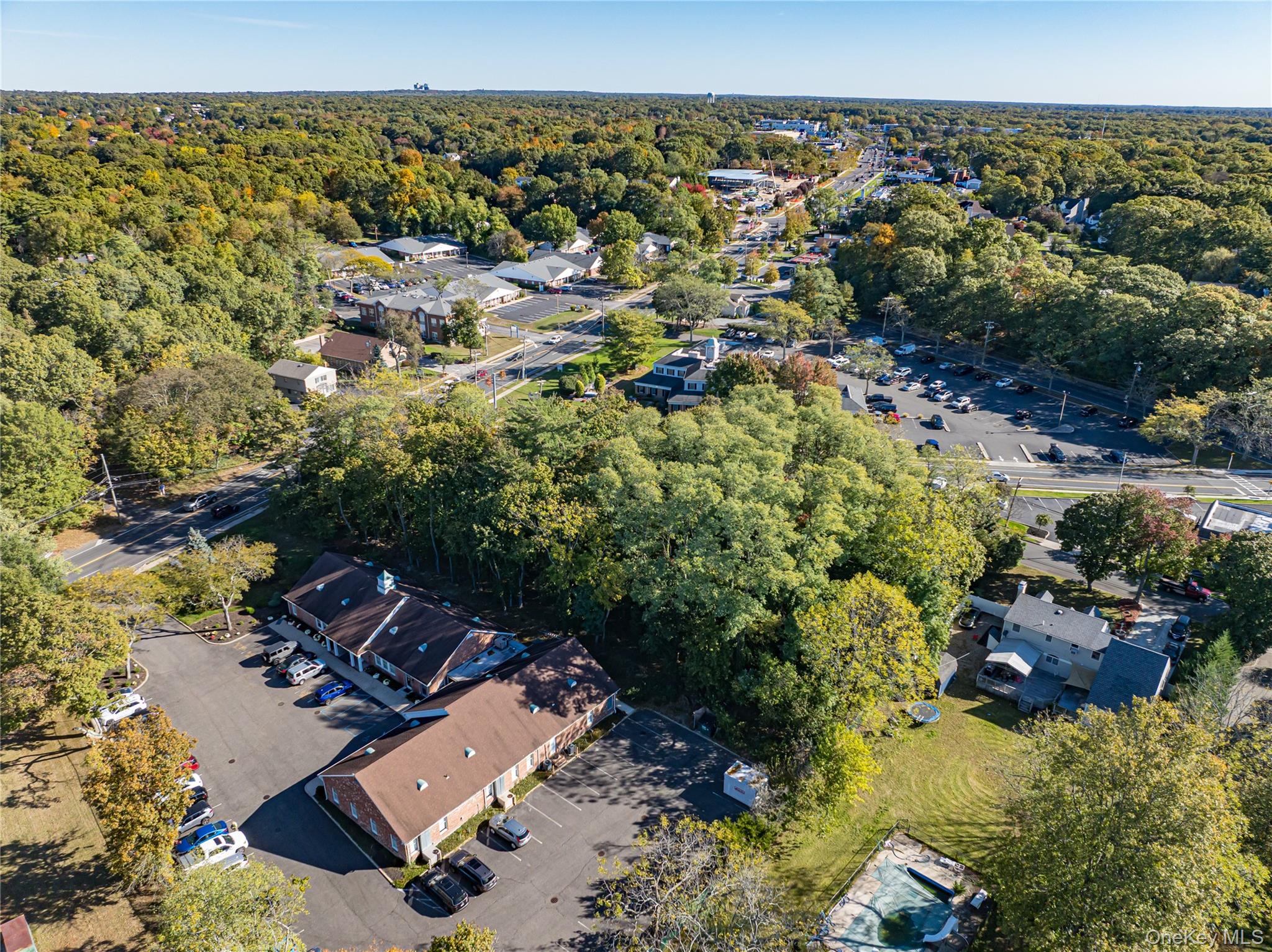 Middle Country Road Smithtown, NY 11780 - Photo 15 of 23 an aerial view of a house with a lake view