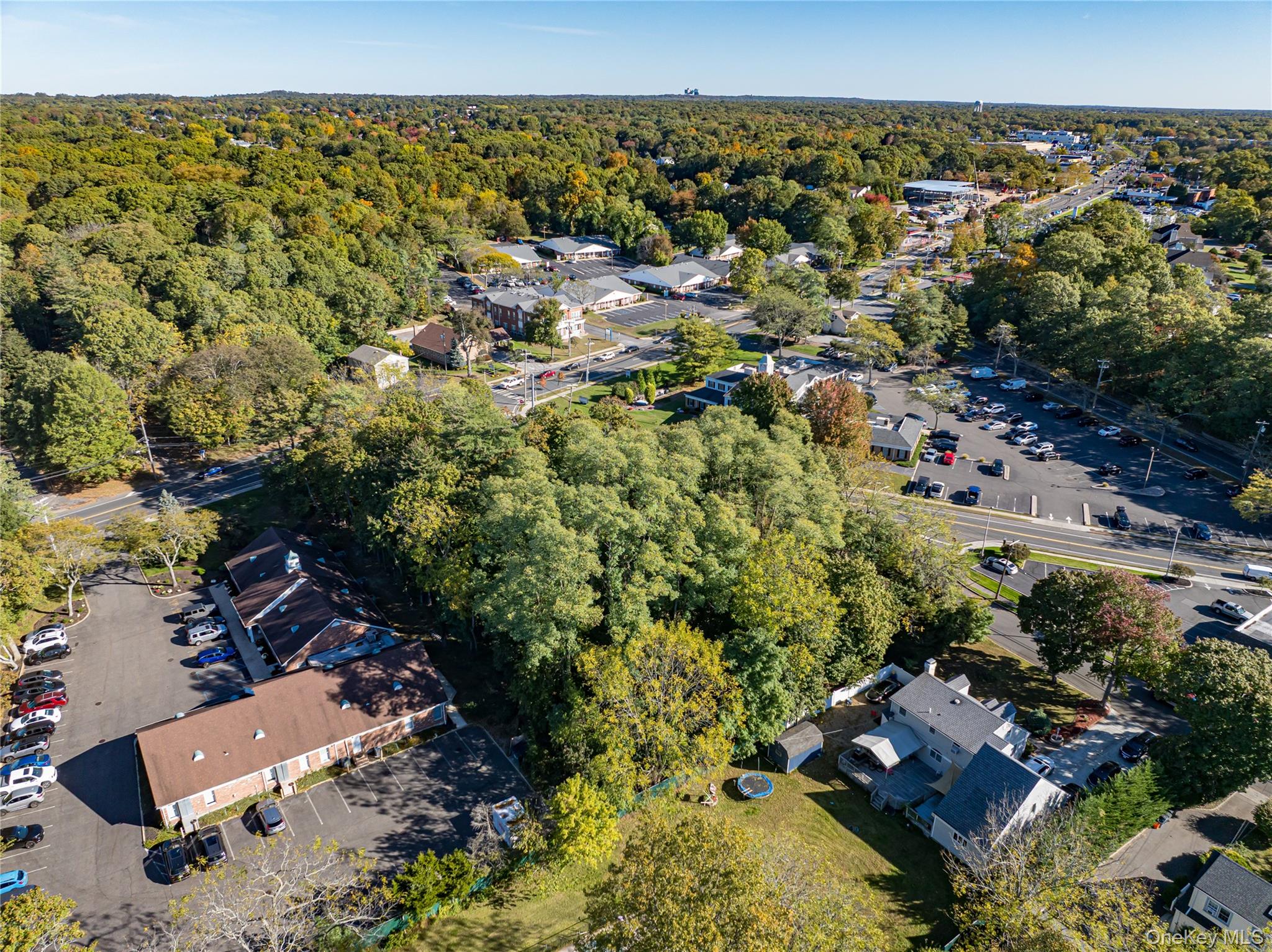 Middle Country Road Smithtown, NY 11780 - Photo 16 of 23 an aerial view of a house with a yard
