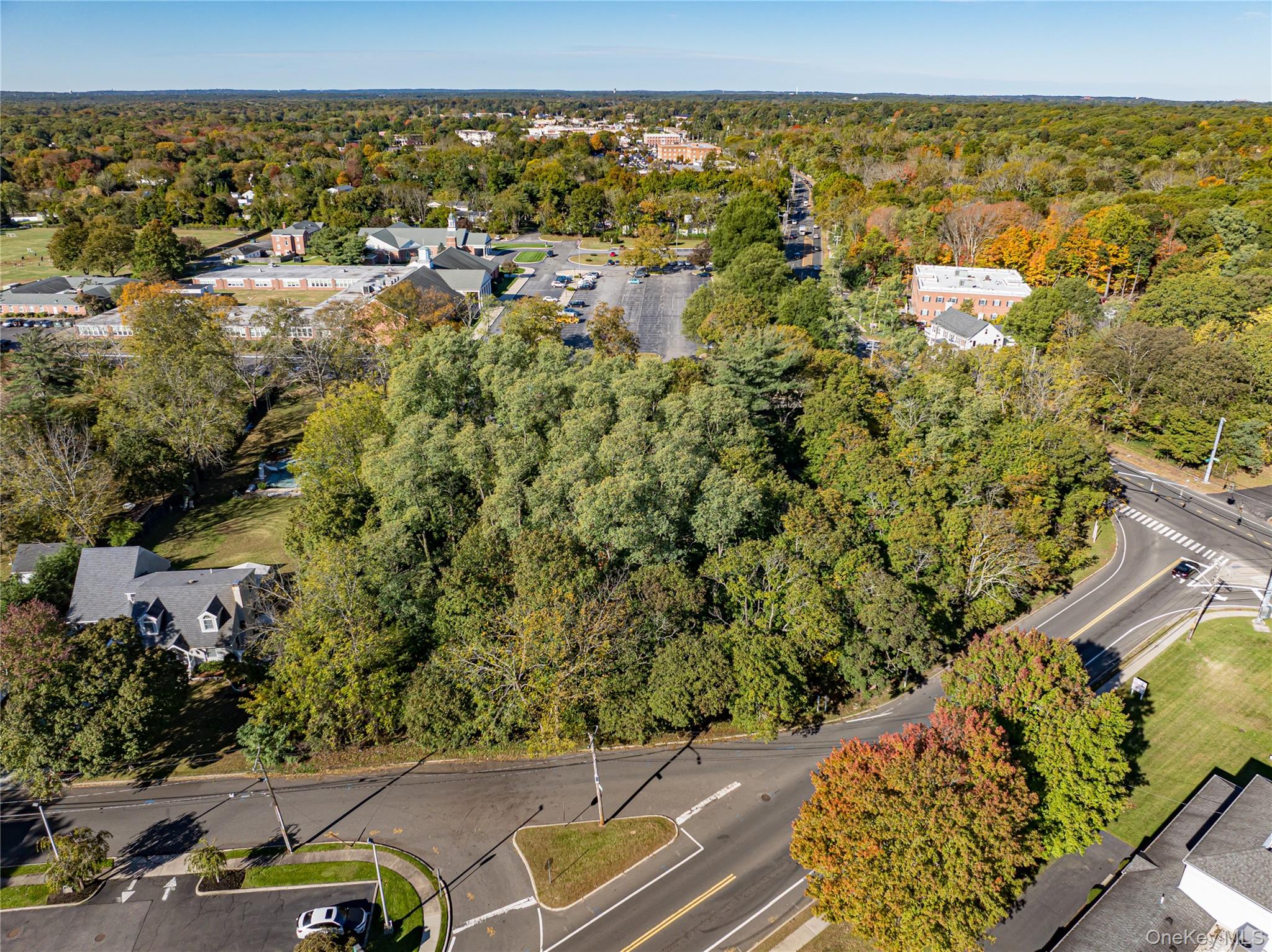 Middle Country Road Smithtown, NY 11780 - Photo 3 of 23 an aerial view of residential houses with outdoor space