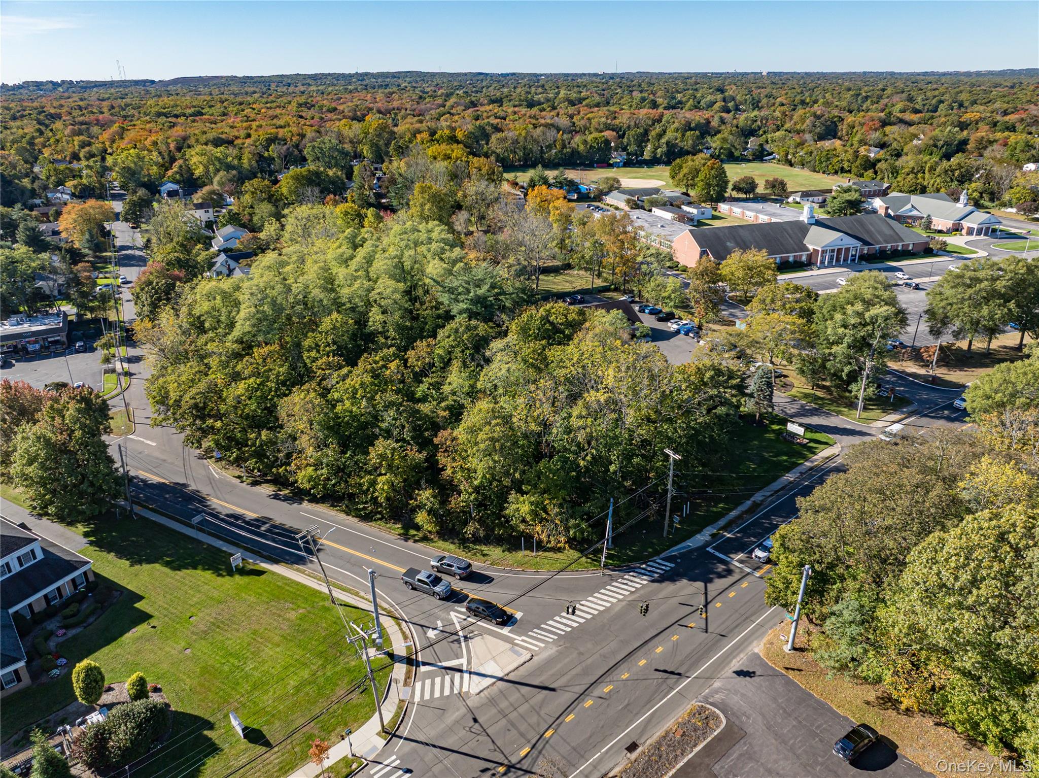 Middle Country Road Smithtown, NY 11780 - Photo 7 of 23 an aerial view of residential houses with outdoor space