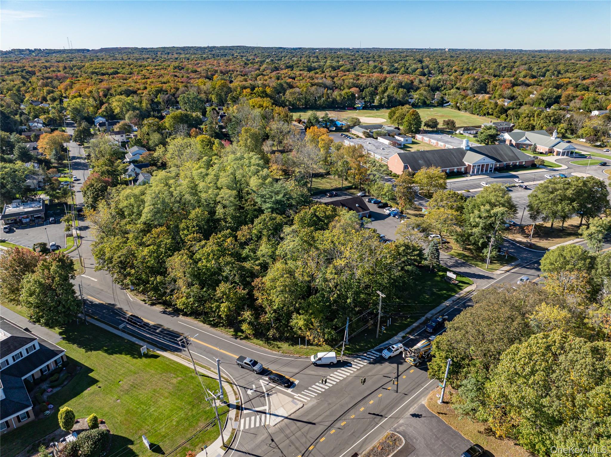 Middle Country Road Smithtown, NY 11780 - Photo 8 of 23 an aerial view of residential houses with outdoor space
