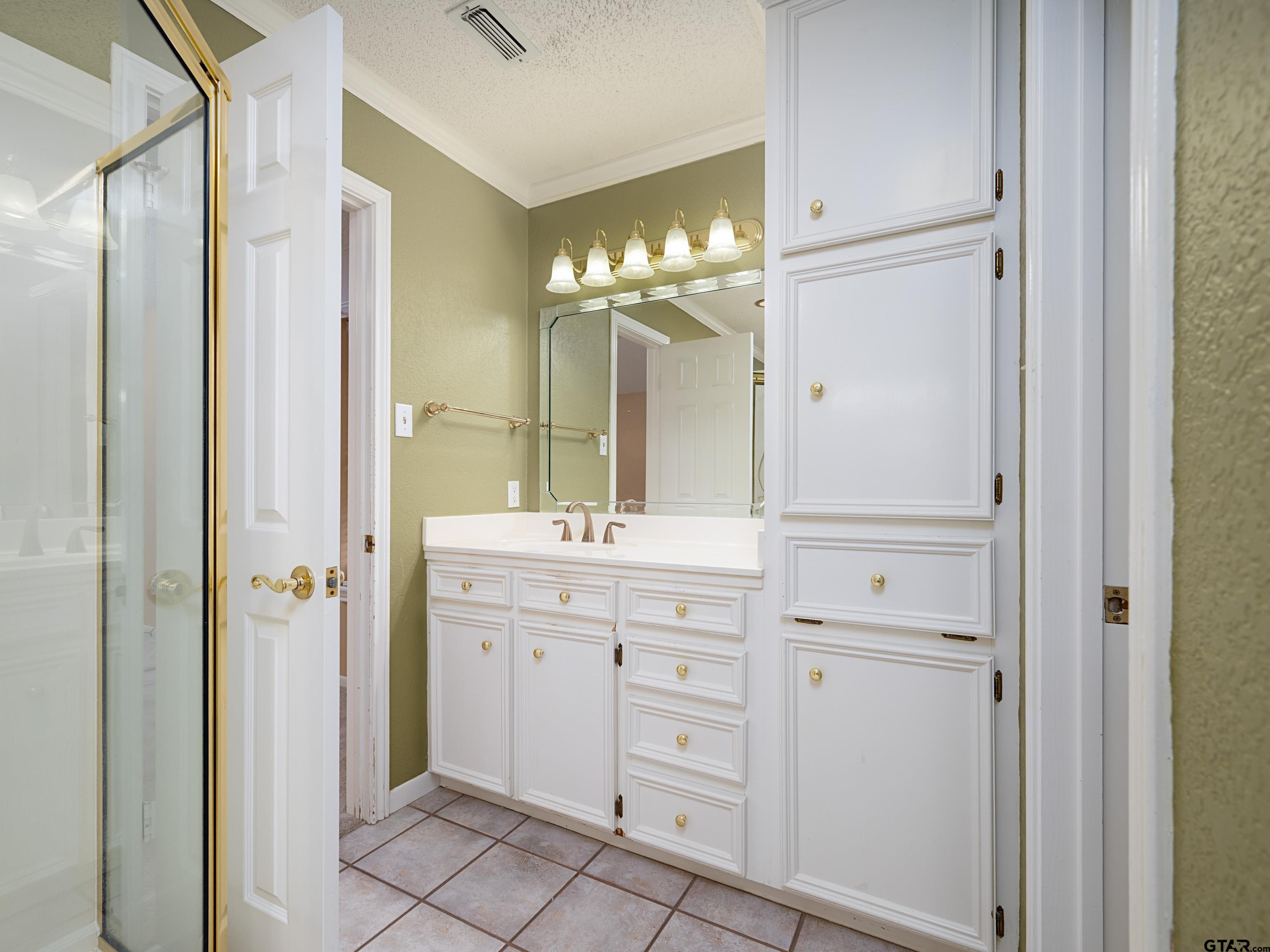 17984 Briarcrest Flint, TX 75762 - Photo 18 of 29 a bathroom with a double vanity sink and mirror
