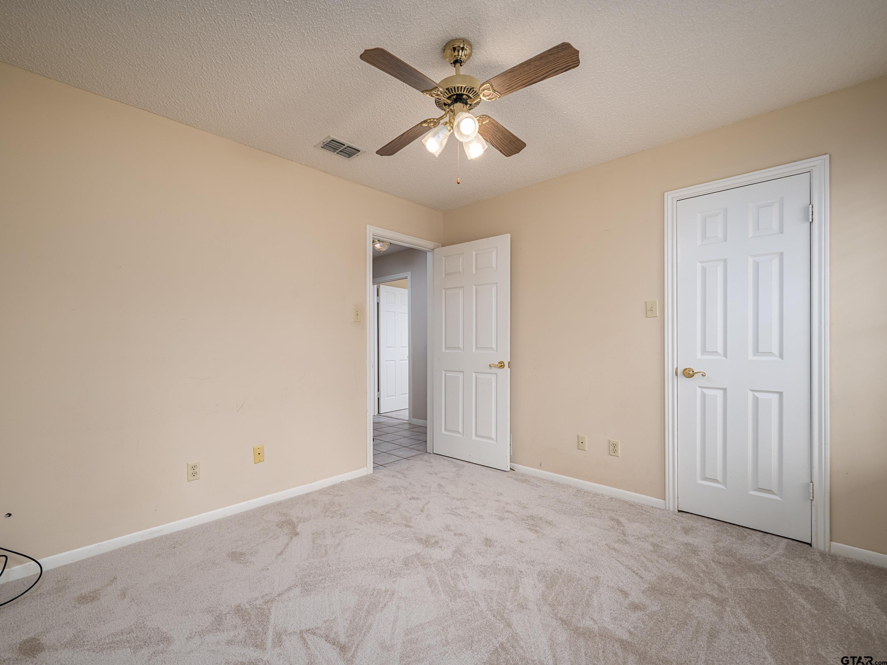 17984 Briarcrest Flint, TX 75762 - Photo 22 of 29 an empty room with closet and fan