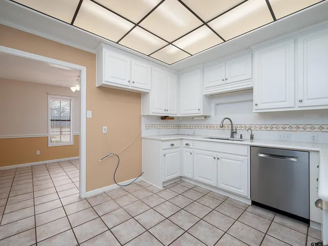 a kitchen with cabinets and appliances